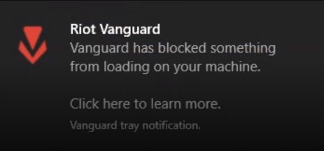 A screenshot of a Riot Vanguard tray notification.The text reads: Riot Vanguard – Vanguard has blocked something from loading on your machine.Click here to learn more.Vanguard tray notification.