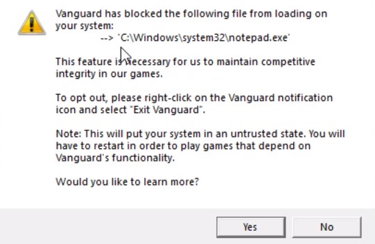 ภาพหน้าจอของการแจ้งเตือนของระบบ Windows ข้อความบอกว่า: Vanguard ได้บล็อคระบบของคุณไม่ให้โหลดไฟล์ต่อไปนี้: C:\Windows\system32\notepad.exe ฟีเจอร์นี้มีความจำเป็นสำหรับพวกเราในการรักษาความซื่อสัตย์สมบูรณ์ของการแข่งขันในเกมของเราเอาไว้